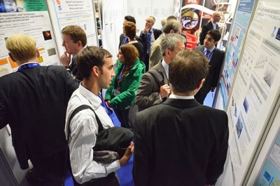 Poster session at one of the conferences at Photonex Visitors at a poster session
