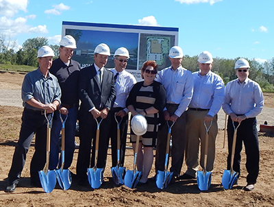 Renishaw Inc. President Leo Somerville (third from left) and members of the company’s senior executive management team break ground on the new facility. Photograph of Renishaw’s senior executive management team breaking ground on the new facility